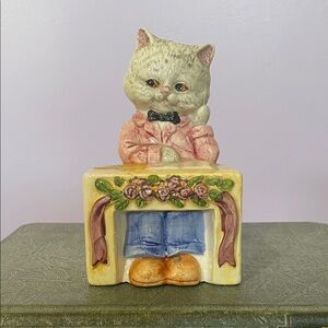 Vintage Cat Figurine with Pink Jacket sitting at school desk